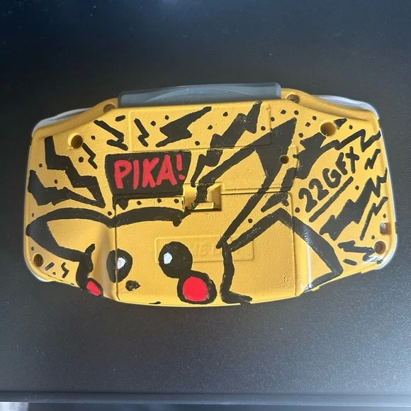 Custom (Pika) Gameboy advanced and Pokémon Red and Gold games.